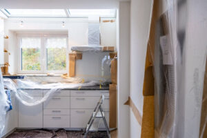 A-kitchen-in-renovation-covered-in-paper-and-plastic
